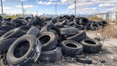 ai generated old tires dumped in landfill a pile of old tires at an industrial site photo x